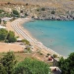 Lindos Beach In Rhodes - Courtesy Of MJJR (Wikimedia Commons)